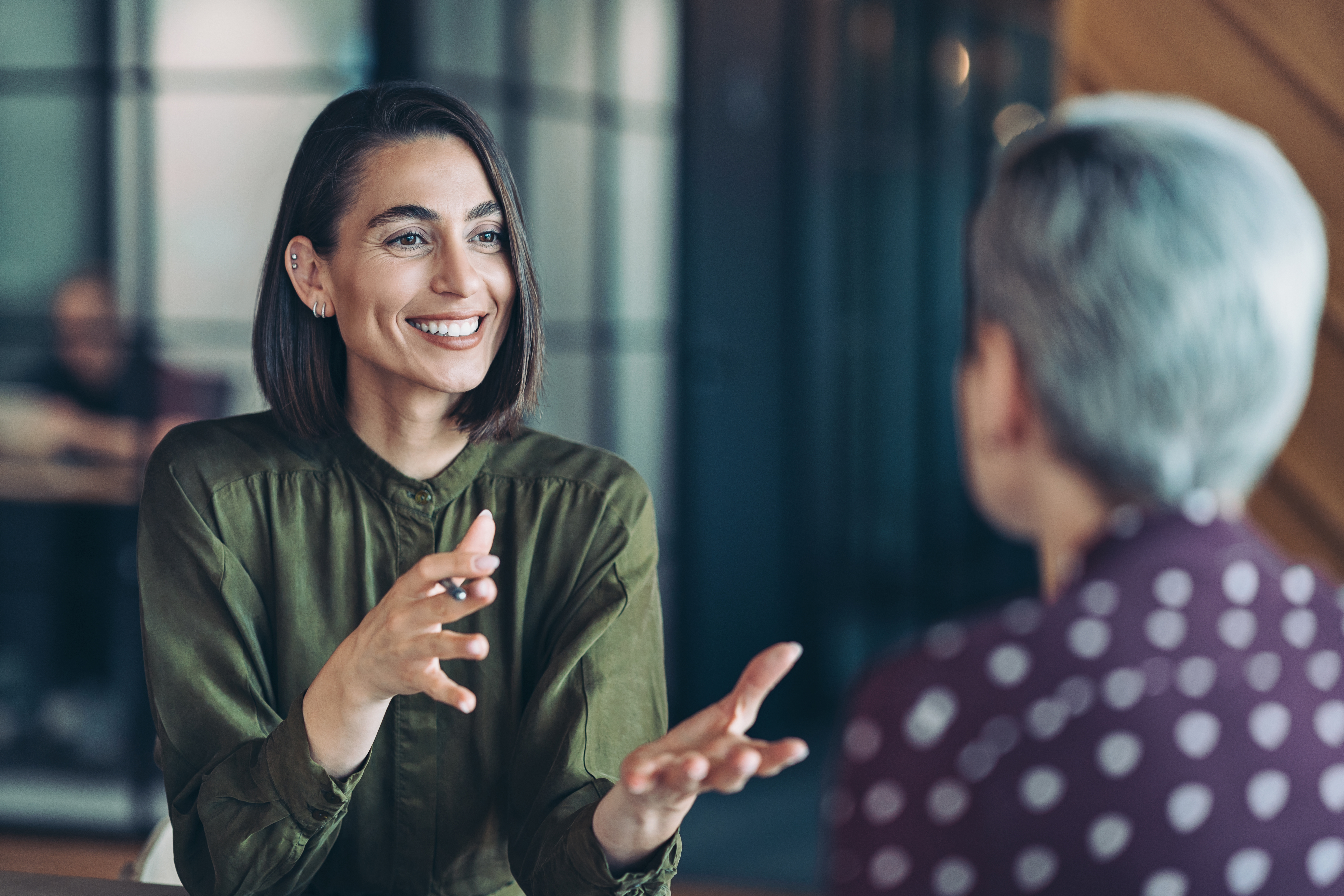 Two businesswomen talking in the office