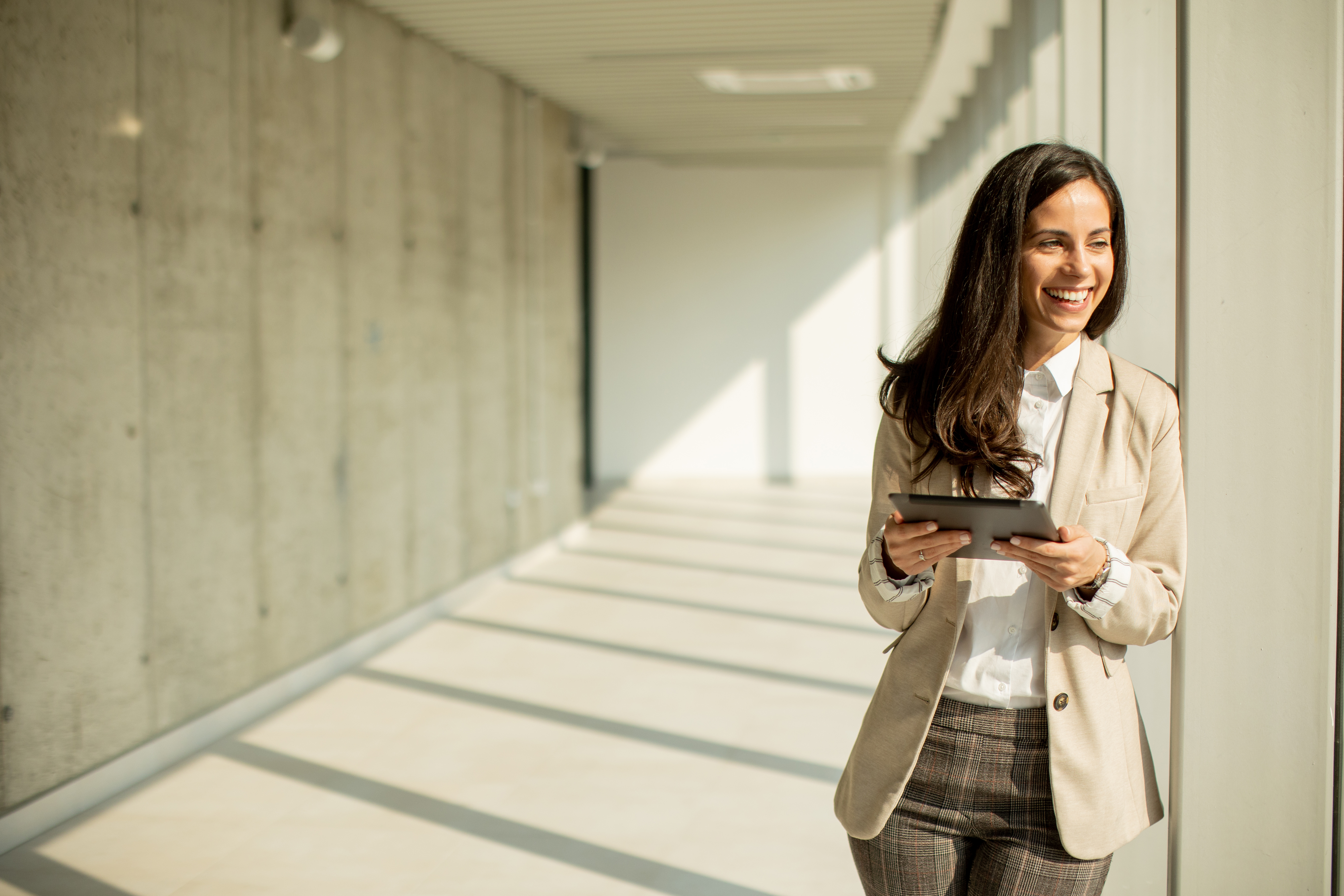 Young business woman at startup office with digital table