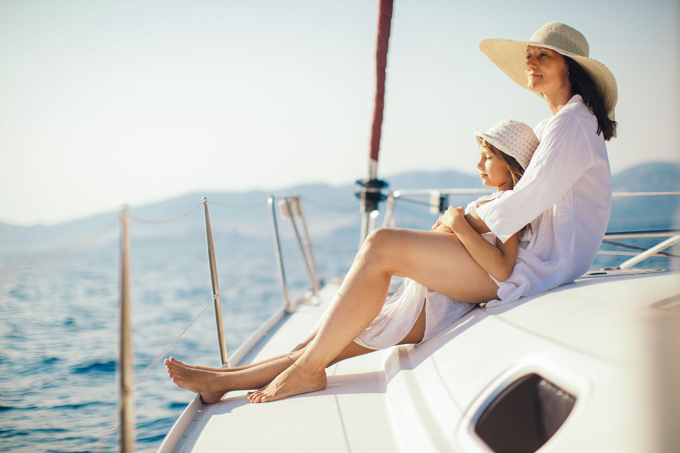 Mother and daughter enjoying on yacht